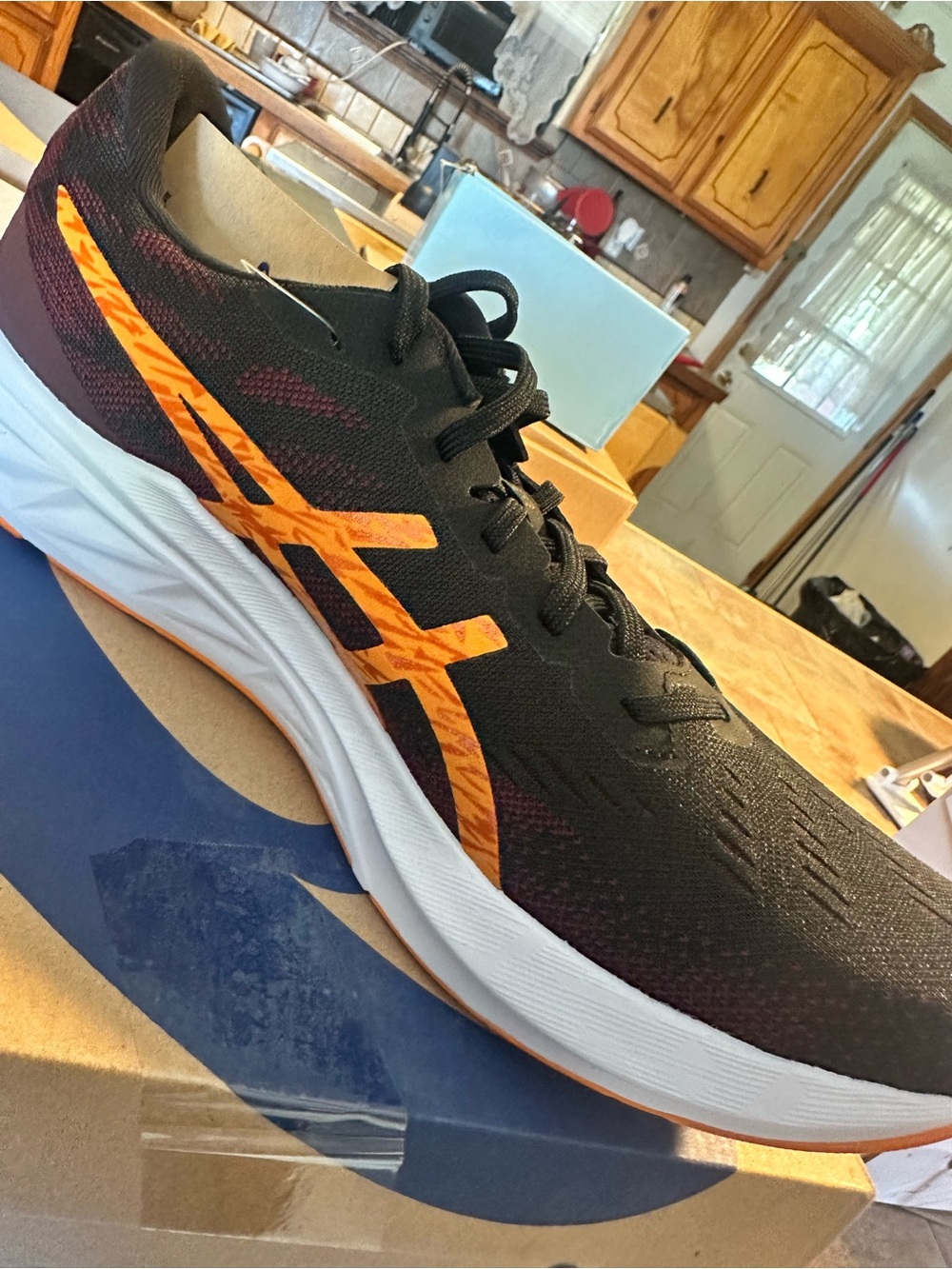 Asics Men's Black Athletic Shoes with Orange Accents